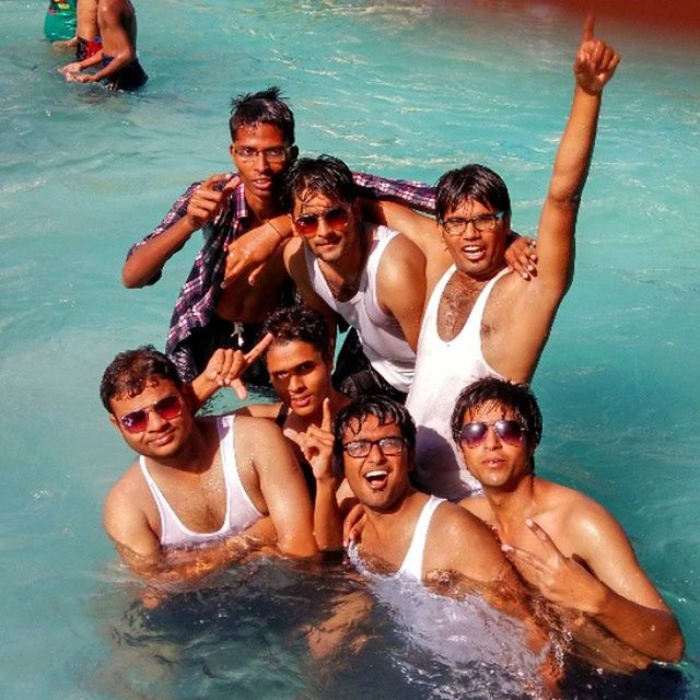 water, togetherness, leisure activity, lifestyles, bonding, enjoyment, person, love, vacations, happiness, fun, family, friendship, sea, shirtless, young adult, smiling, childhood