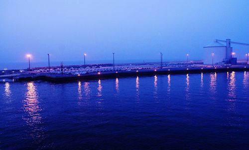 View of illuminated sea at night