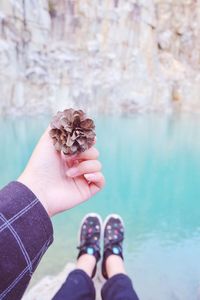 Low section of woman legs in water