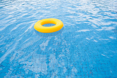 High angle view of yellow floating on water