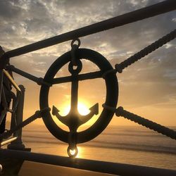 Close-up of sea against sky during sunset