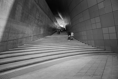 Man walking in subway tunnel