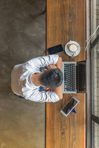 High angle view of man using mobile phone