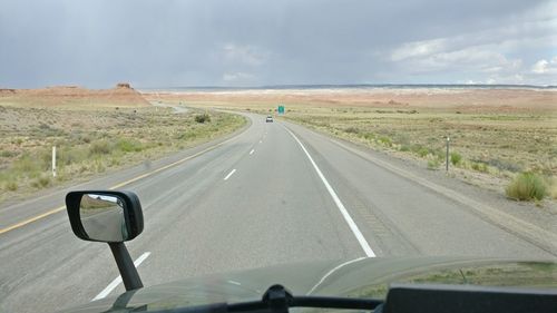 Car on highway against sky