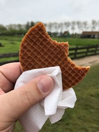 Midsection of person holding ice cream