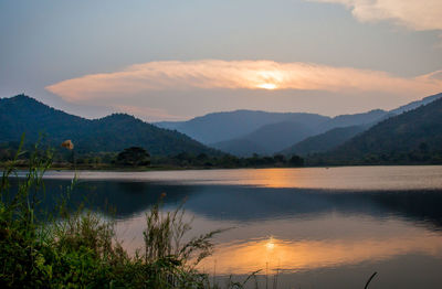 Scenic view of lake against sky during sunset