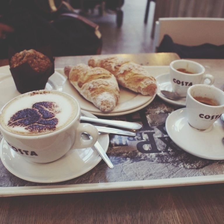 food and drink, table, coffee cup, drink, indoors, freshness, coffee - drink, saucer, refreshment, spoon, coffee, still life, plate, cup, food, breakfast, ready-to-eat, frothy drink, close-up, high angle view