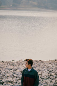 Rear view of man standing on beach