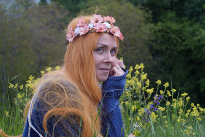 Portrait of woman with purple flowers