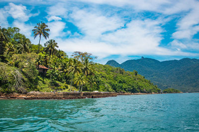 Scenic view of sea against blue sky