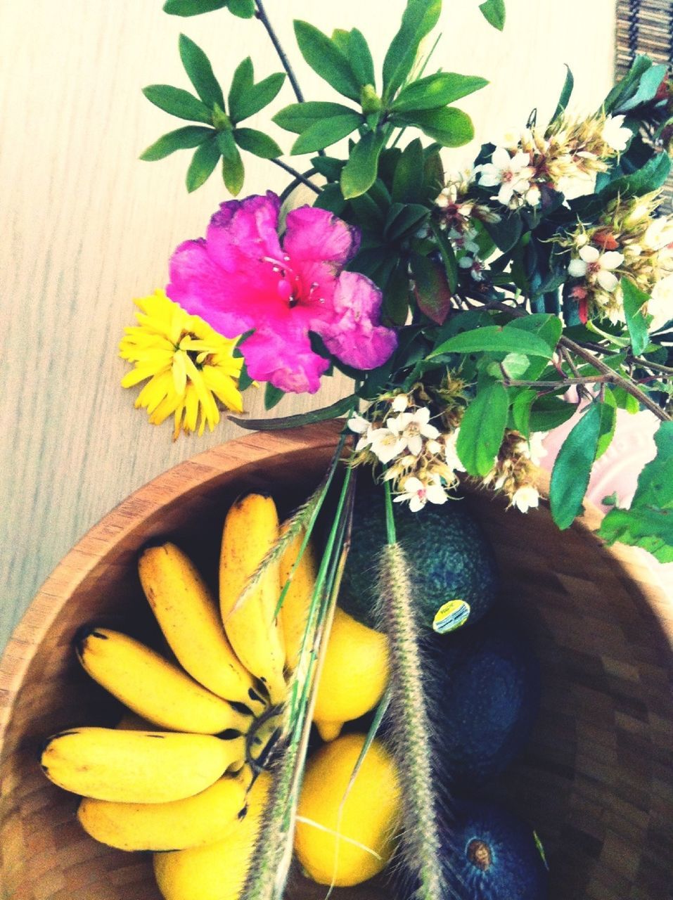 flower, freshness, yellow, table, high angle view, still life, indoors, fragility, wood - material, close-up, food, petal, food and drink, wooden, no people, leaf, vase, day, fruit, flower head