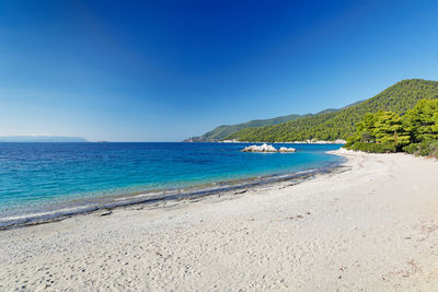 Scenic view of sea against clear blue sky