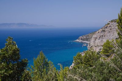 Scenic view of sea against clear blue sky