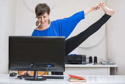 Young woman using laptop at home