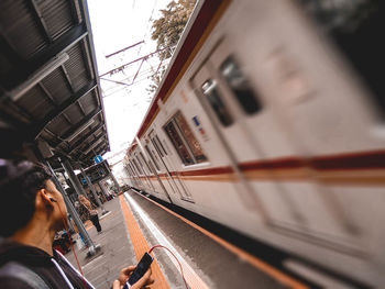 Blurred motion of train at railroad station