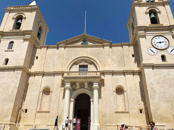 Facade of historic building against sky