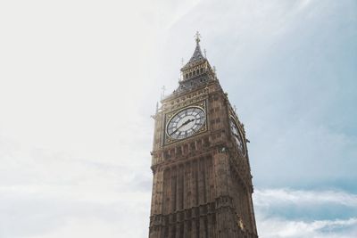 Low angle view of clock tower against sky