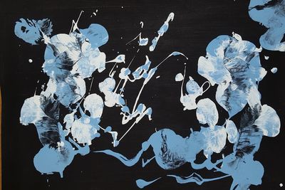 High angle view of painting on black background