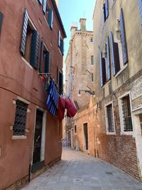 Low angle view of clothes drying on building