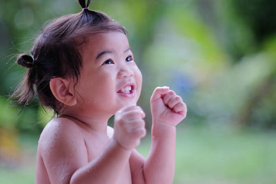 Close-up of girl looking up outdoors