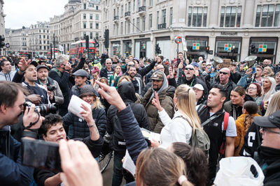 Group of people in front of buildings