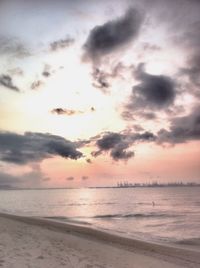 Scenic view of sea against cloudy sky