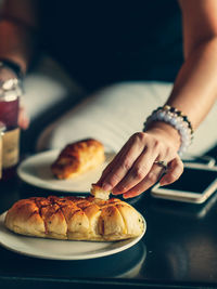 Close-up of hand holding ice cream