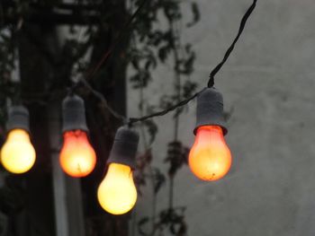 Low angle view of illuminated light bulb