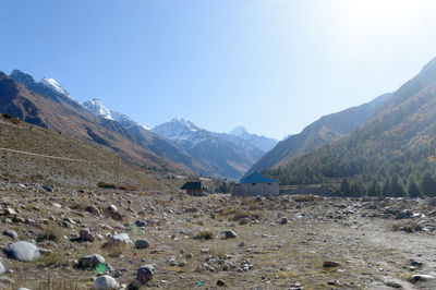 Scenic view of snowcapped mountains against sky