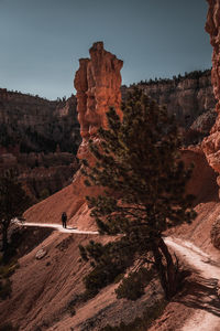 Rock formations on landscape against sky