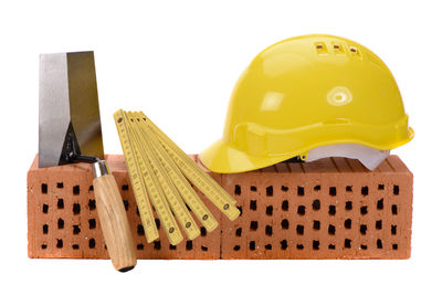 Close-up of yellow hat against white background