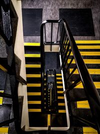 High angle view of yellow staircase in building