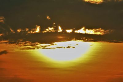 Low angle view of dramatic sky during sunset