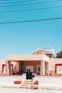 Buildings against clear blue sky