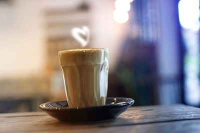 Close-up of coffee cup on table