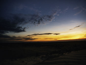 Scenic view of silhouette landscape against sky during sunset