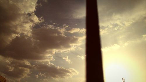 Low angle view of cloudy sky at sunset