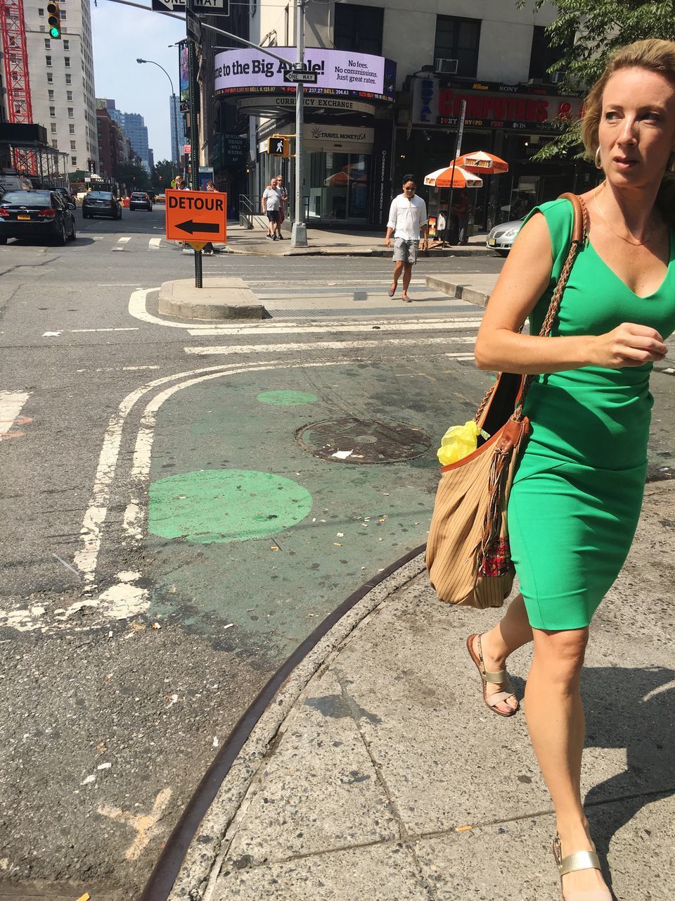 WOMAN WALKING ON STREET IN CITY