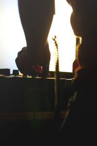 Cropped image of man standing in darkroom