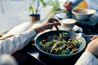 Midsection of woman having food