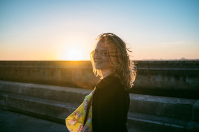 Portrait of woman at sunset