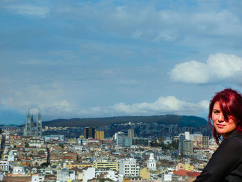 Portrait of woman against cityscape