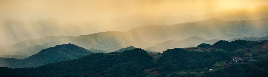 Scenic view of mountains against sky during sunset