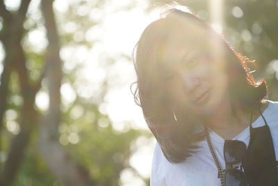 Portrait of young woman outdoors