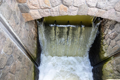 Scenic view of water flowing through wall