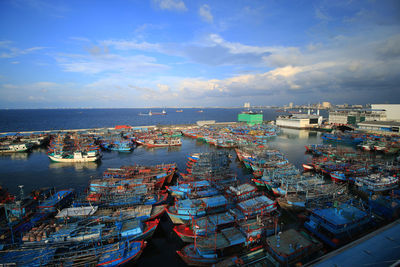 High angle view of harbor by sea against sky