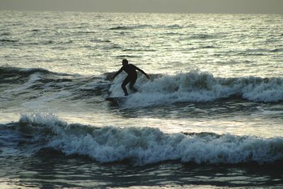 Man surfing in sea