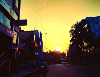 Cars on road at sunset