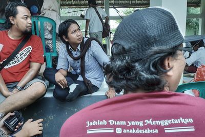 Rear view of people sitting in bus