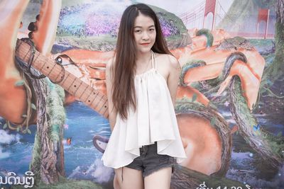 Portrait of beautiful woman standing in water